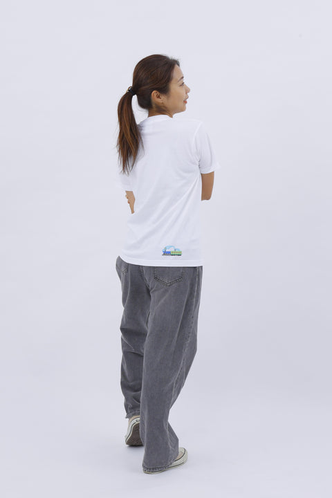 Rear view of the woman walking away, showing the back print of the "Train" T-shirt clearly.