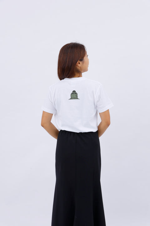 Back view of the woman wearing the "Kamakura Daibutsu" T-shirt, showing the rear print and skirt.