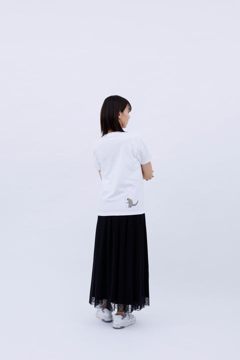 Rear view of the woman in the "Five-story Pagoda & Kaiju Monster" T-shirt and skirt, showing the plain back.