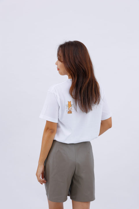 Side view of the model in the "Shiba Inu" T-shirt, showing the back design and her long hair.
