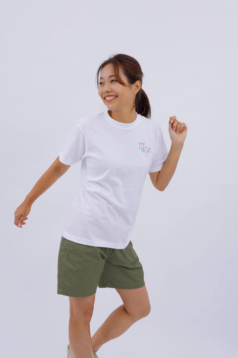 Dynamic side view of the woman in the "Dove" T-shirt, raising one arm in a playful pose.