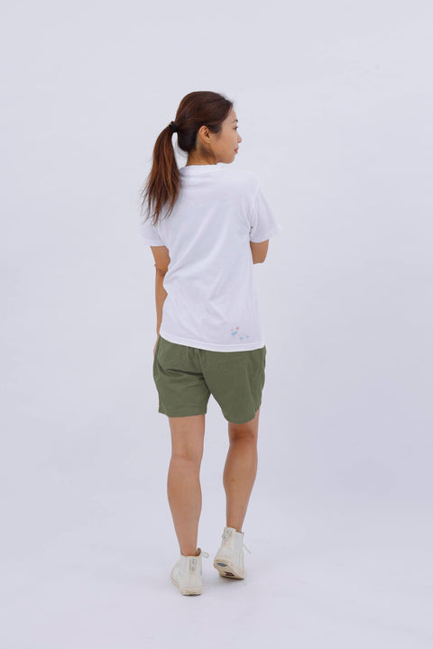 Back view of the model wearing the "Dove" T-shirt, standing straight and facing away.