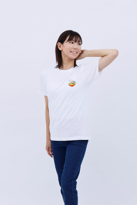 Front view of a smiling woman wearing the white "Ramen" T-shirt and blue jeans, posing with one hand behind her neck.