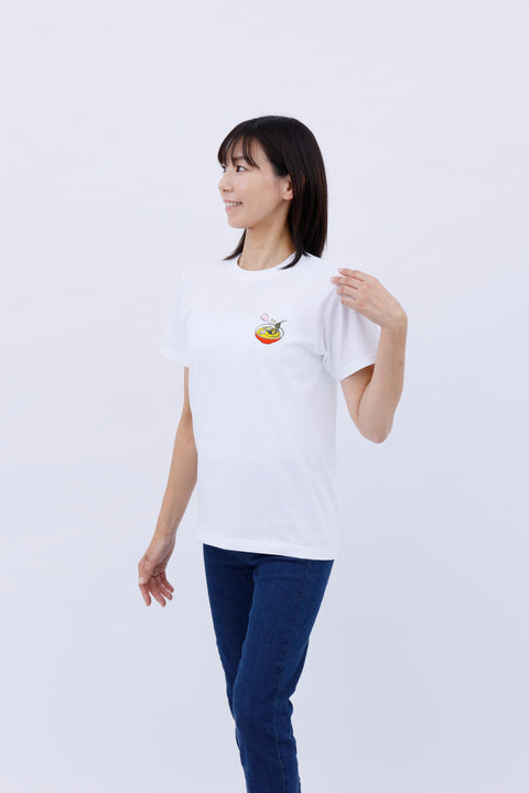 Angled side view of the woman wearing the "Ramen" T-shirt and jeans, posing with one hand on her hip.