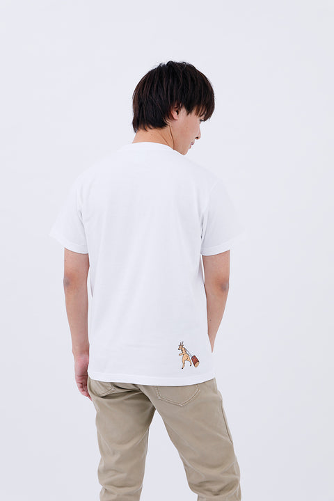 Rear view of the man wearing the "Macho Deer" T-shirt and beige pants, standing casually.
