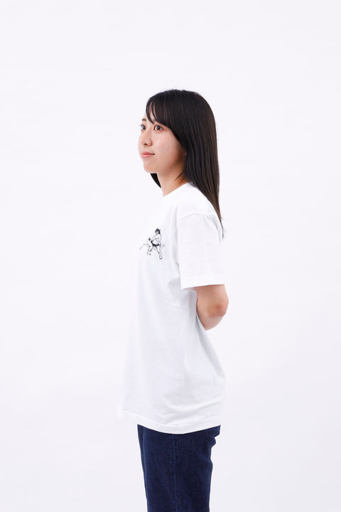 Side view of the woman wearing the "Japan's National Sport" T-shirt and jeans, standing with a relaxed posture.