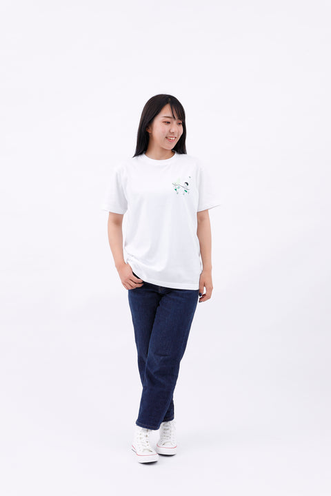 Angled front view of the model in the "Summer Holidays" T-shirt and jeans, walking casually.
