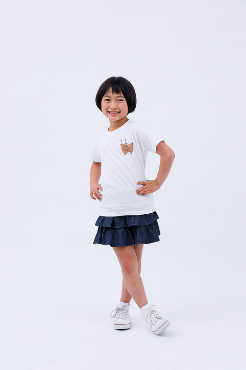 Side pose of child wearing white T-shirt "Deer & Ninja" with hand on hip