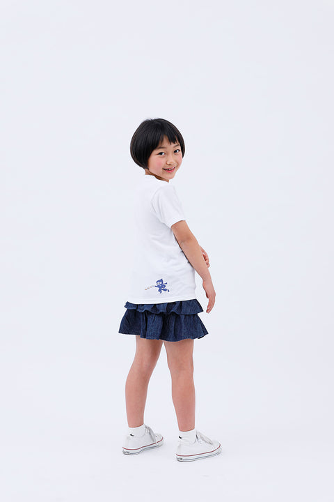 Side view of child wearing white T-shirt "Deer & Ninja" looking over shoulder
