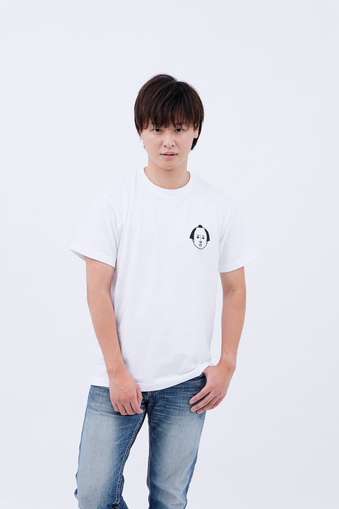 Front view of a man wearing the white "Edo Face" T-shirt and blue jeans, looking straight at the camera.