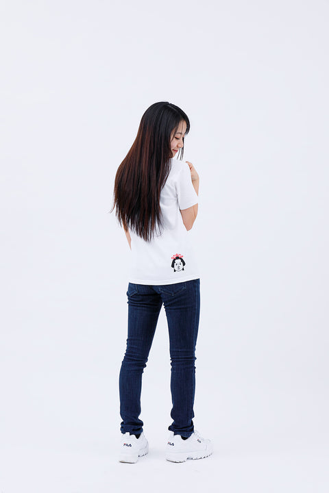 Side view of the woman wearing the "Edo Face" T-shirt and jeans, with long hair flowing down her back.