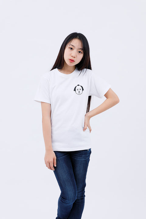Front view of a woman wearing the "Edo Face" T-shirt and blue jeans, smiling softly.
