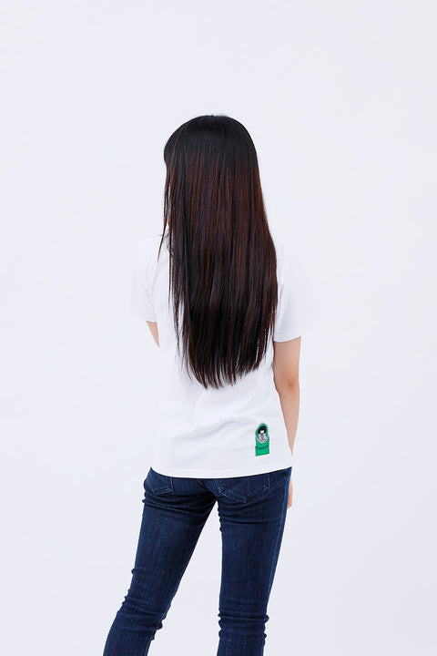 Rear view of the woman wearing the "Kaguyahime" T-shirt and jeans, with long hair flowing down her back.