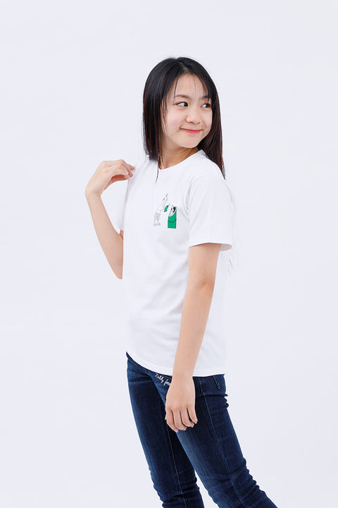 Side view of the woman in the "Kaguyahime" T-shirt and jeans, smiling softly.