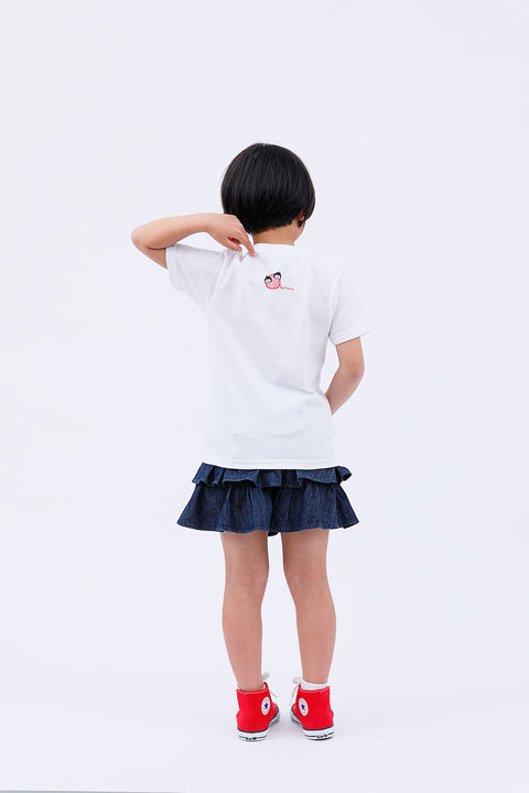 Rear view of the child in the "Sumo Wrestler & Ayatori" T-shirt and skirt, walking away.