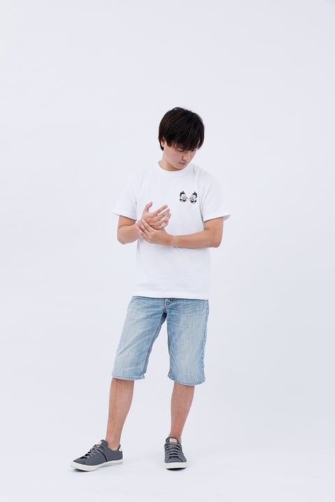 Front view of the man in the "Sumo Wrestler & Ayatori" T-shirt and jeans, looking down slightly.
