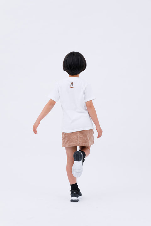 Full-body rear view of the child wearing the "Sparrow in Love" T-shirt and skirt, mid-step.