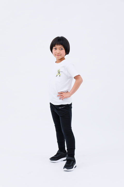 Full-body front view of the child in the "Ninja" T-shirt and pants, standing casually.