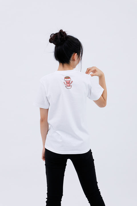 Rear angled view of the woman wearing the "Takoyaki" T-shirt and black pants, standing casually.