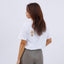 Side view of the model in the "Shiba Inu" T-shirt, showing the back design and her long hair.