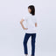 Full-body rear view of the woman wearing the "Ramen" T-shirt and blue jeans, standing straight and facing away.