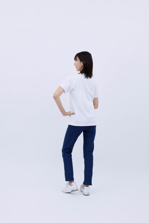 Full-body rear view of the woman wearing the "Ramen" T-shirt and blue jeans, standing straight and facing away.